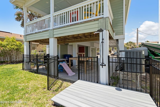 exterior space with fence and a deck
