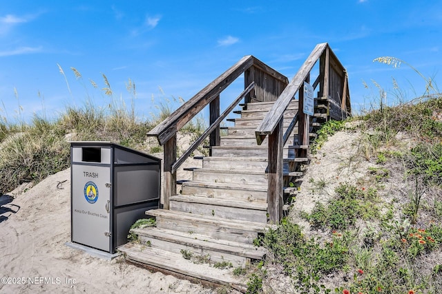 view of property's community featuring stairs