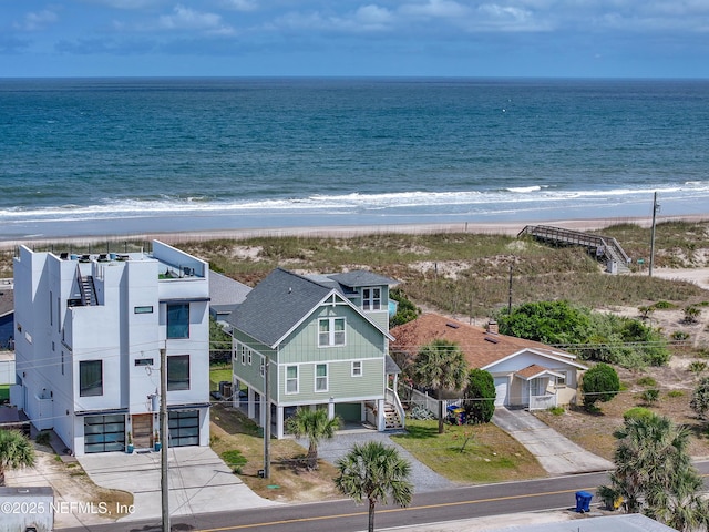 bird's eye view with a water view and a view of the beach