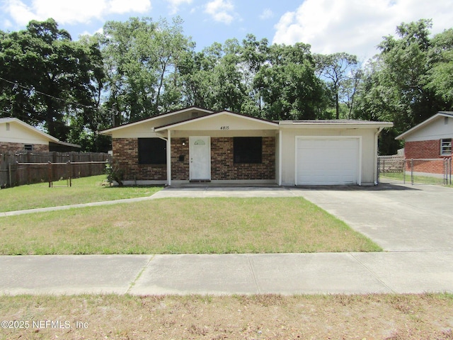 ranch-style house with an attached garage, a front lawn, fence, and concrete driveway