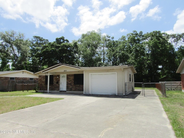 single story home featuring a gate, fence, driveway, and a front yard