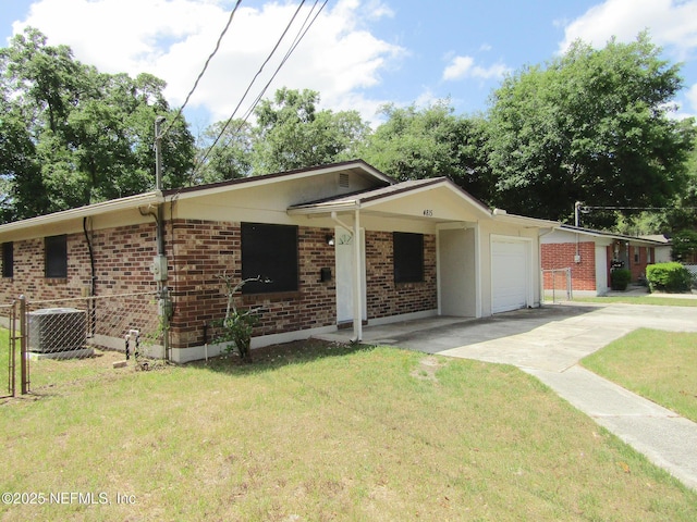 ranch-style house featuring cooling unit, driveway, a front lawn, and brick siding