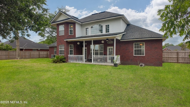 1296 Copper Creek Dr, Macclenny, FL 32063 - rear view of property featuring a shingled roof, brick siding, a lawn, and a fenced backyard