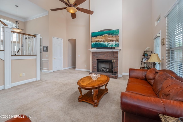 1296 Copper Creek Dr, Macclenny, FL 32063 - living area with carpet flooring, a high ceiling, a fireplace, baseboards, and ceiling fan