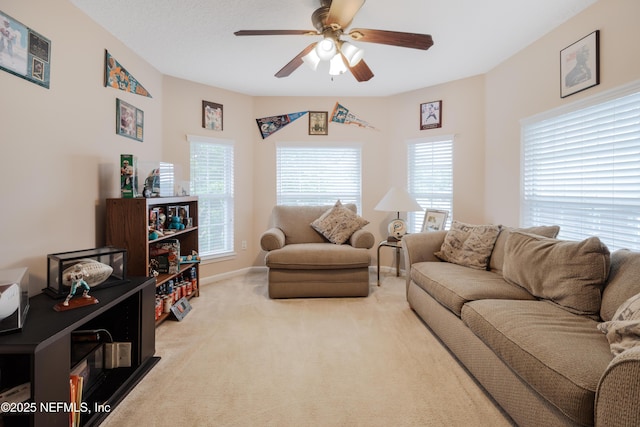 1296 Copper Creek Dr, Macclenny, FL 32063 - carpeted living area with baseboards and a ceiling fan
