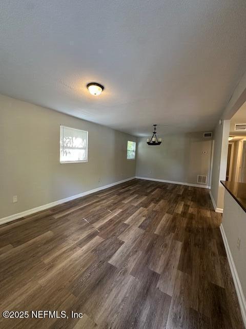 3262 Dignan St, Jacksonville, FL 32254 - spare room featuring visible vents, baseboards, and dark wood-style floors