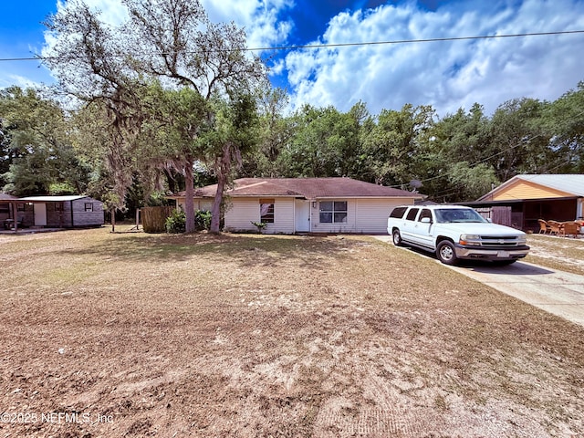 4503 Royal St, Palatka, FL 32177 - single story home with a storage unit, an outbuilding, and concrete driveway