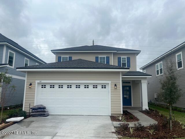 568 Farmfield Dr, Saint Augustine, FL 32092 - traditional-style home with an attached garage and driveway