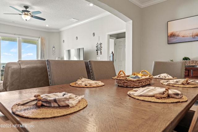 dining area featuring ceiling fan, ornamental molding, recessed lighting, and a textured ceiling