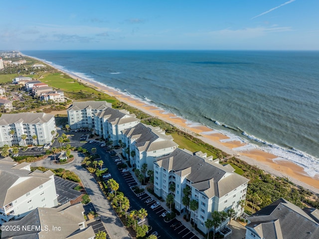 aerial view of unending shoreline and apartment complex / building