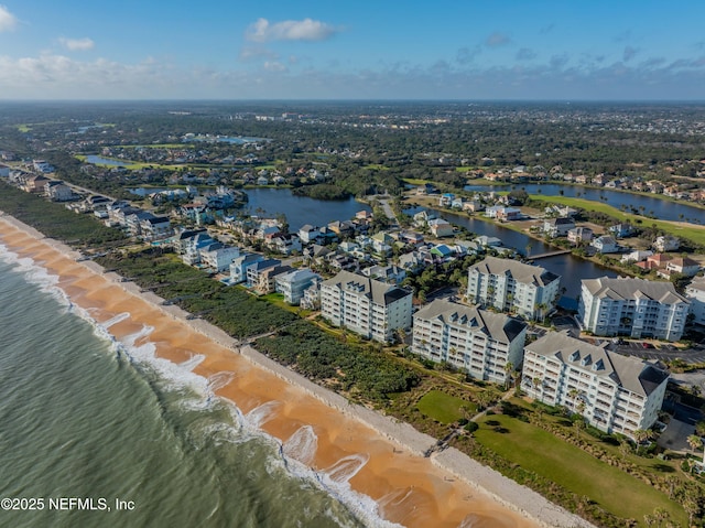 drone / aerial view of unending shoreline and apartment complex