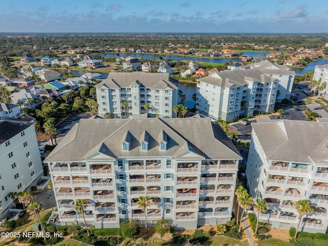bird's eye view of apartment complex / building and a large body of water