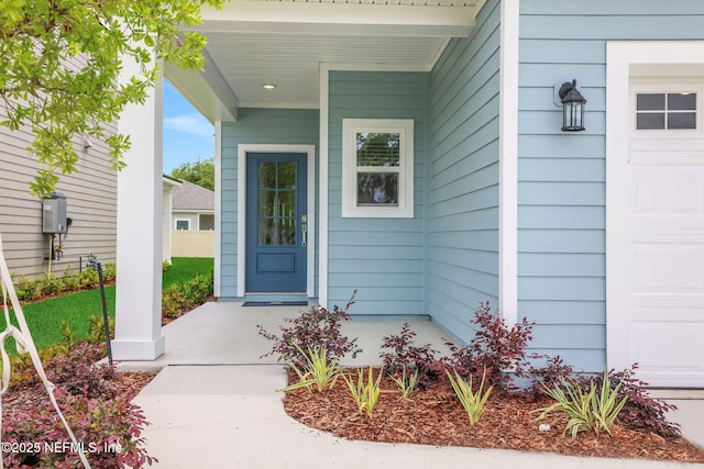 37 Bird Watch Ct, Saint Augustine, FL 32092 - doorway to property featuring a porch and an attached garage