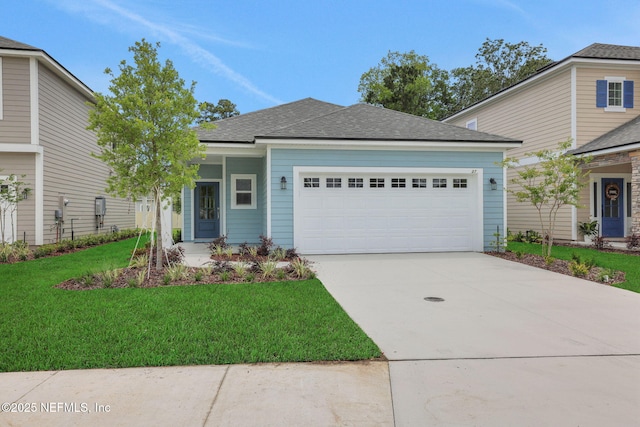 37 Bird Watch Ct, Saint Augustine, FL 32092 - view of front of home with a garage, a front yard, driveway, and a shingled roof