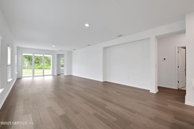 37 Bird Watch Ct, Saint Augustine, FL 32092 - unfurnished living room with wood finished floors, baseboards, and recessed lighting