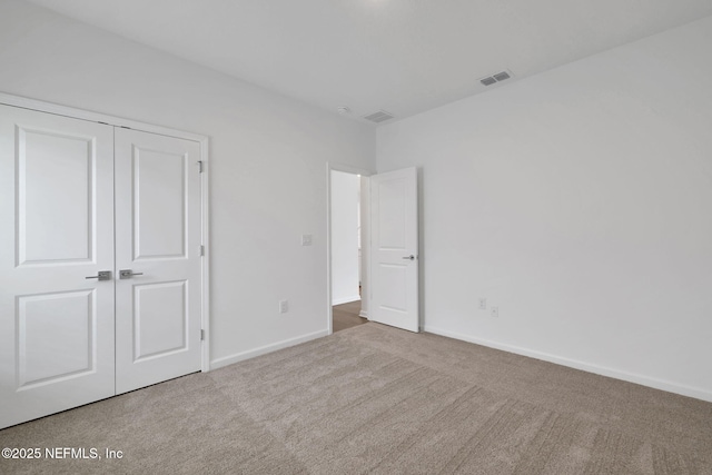 37 Bird Watch Ct, Saint Augustine, FL 32092 - unfurnished bedroom with carpet, baseboards, and a closet