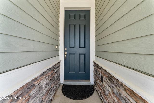 513 Sandstone Dr, Saint Augustine, FL 32086 - property entrance with stone siding