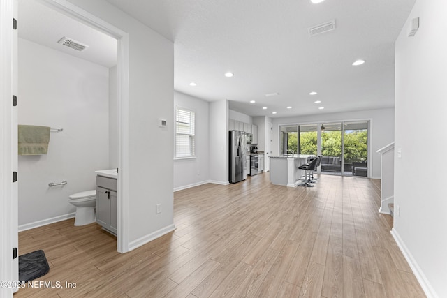 513 Sandstone Dr, Saint Augustine, FL 32086 - unfurnished living room featuring recessed lighting, light wood finished floors, and visible vents