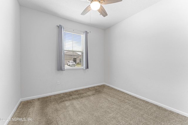 513 Sandstone Dr, Saint Augustine, FL 32086 - spare room featuring baseboards, carpet, and a ceiling fan