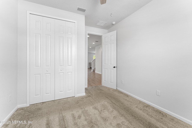 513 Sandstone Dr, Saint Augustine, FL 32086 - unfurnished bedroom with baseboards, carpet, a closet, and visible vents