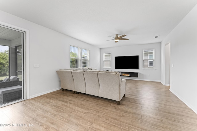 513 Sandstone Dr, Saint Augustine, FL 32086 - living area featuring a ceiling fan, baseboards, visible vents, and light wood-style flooring