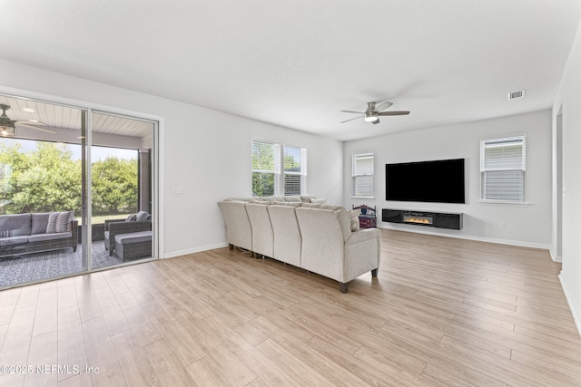 513 Sandstone Dr, Saint Augustine, FL 32086 - living area with light wood-style floors, baseboards, a ceiling fan, and visible vents