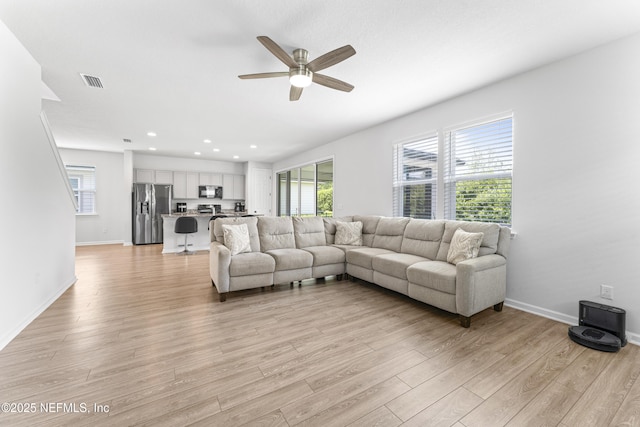 513 Sandstone Dr, Saint Augustine, FL 32086 - living room with visible vents, light wood-style floors, baseboards, recessed lighting, and a ceiling fan