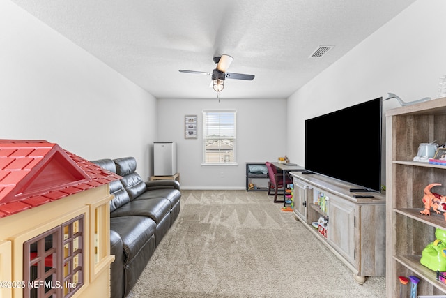 513 Sandstone Dr, Saint Augustine, FL 32086 - recreation room with ceiling fan, carpet floors, a textured ceiling, baseboards, and visible vents