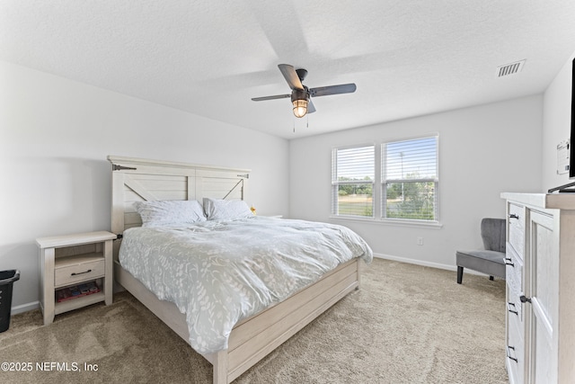 513 Sandstone Dr, Saint Augustine, FL 32086 - carpeted bedroom featuring baseboards, a ceiling fan, a textured ceiling, and visible vents