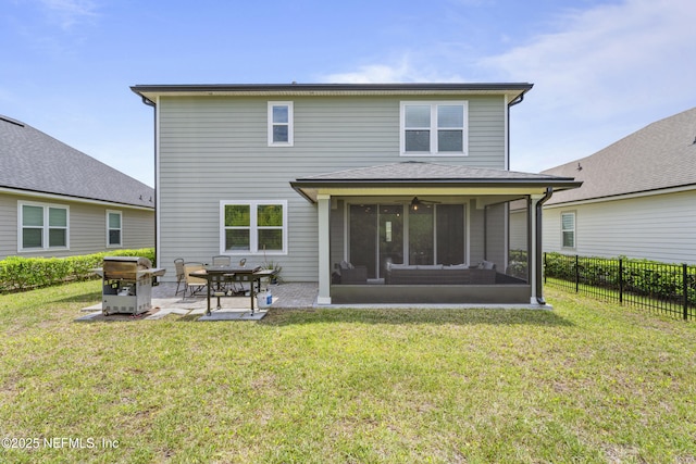 513 Sandstone Dr, Saint Augustine, FL 32086 - rear view of house featuring a yard, a patio, fence, and a sunroom