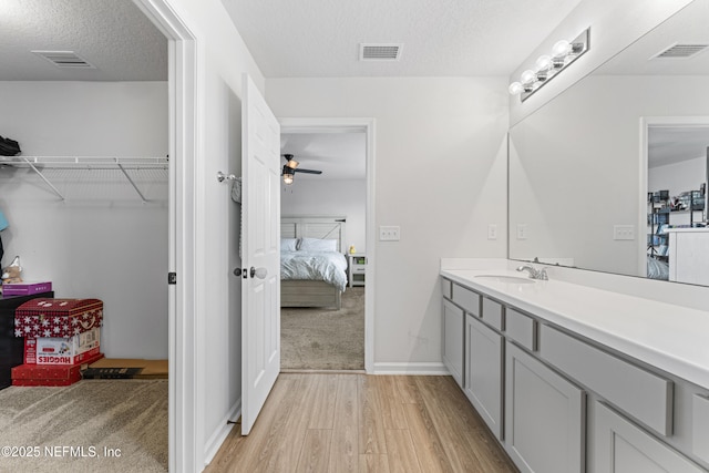 513 Sandstone Dr, Saint Augustine, FL 32086 - bathroom featuring wood finished floors, ensuite bath, and visible vents