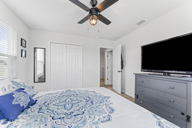 513 Sandstone Dr, Saint Augustine, FL 32086 - carpeted bedroom with visible vents, baseboards, ceiling fan, and a closet