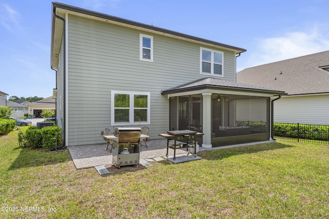 513 Sandstone Dr, Saint Augustine, FL 32086 - back of house with roof with shingles, a sunroom, fence, a yard, and a patio