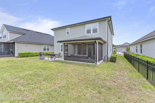 513 Sandstone Dr, Saint Augustine, FL 32086 - rear view of house featuring a sunroom, a lawn, a patio area, and fence private yard