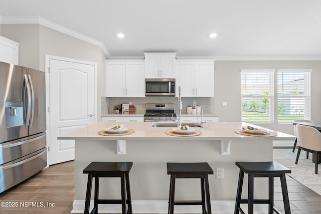 79 Dovetail Cir, Saint Augustine, FL 32095 - kitchen with ornamental molding, decorative backsplash, appliances with stainless steel finishes, and light countertops