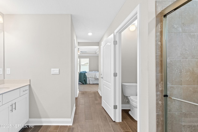 79 Dovetail Cir, Saint Augustine, FL 32095 - ensuite bathroom featuring a stall shower, vanity, baseboards, toilet, and ensuite bath