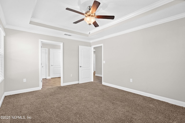 79 Dovetail Cir, Saint Augustine, FL 32095 - unfurnished bedroom featuring crown molding, carpet floors, and a tray ceiling