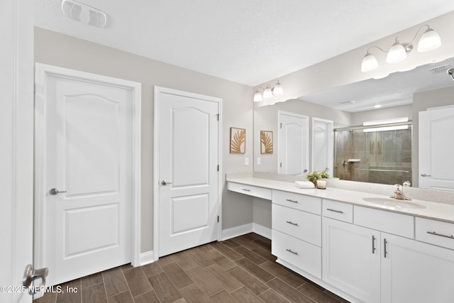 79 Dovetail Cir, Saint Augustine, FL 32095 - bathroom featuring vanity, baseboards, wood tiled floor, visible vents, and a stall shower