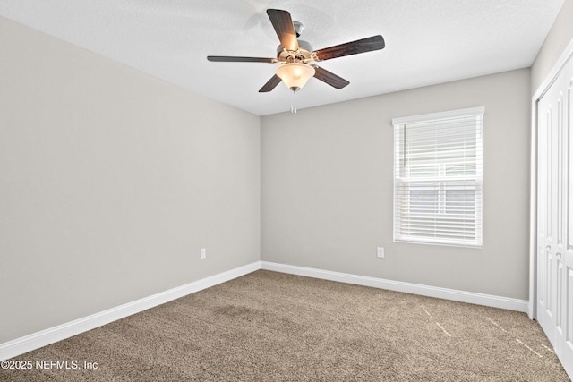 79 Dovetail Cir, Saint Augustine, FL 32095 - unfurnished bedroom with a closet, baseboards, a ceiling fan, and carpet flooring