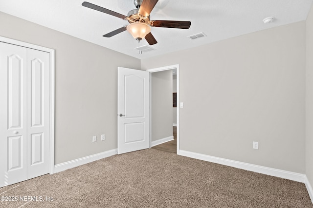 79 Dovetail Cir, Saint Augustine, FL 32095 - unfurnished bedroom featuring a ceiling fan, visible vents, baseboards, a closet, and carpet flooring