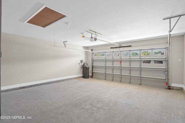 79 Dovetail Cir, Saint Augustine, FL 32095 - garage with baseboards and a garage door opener