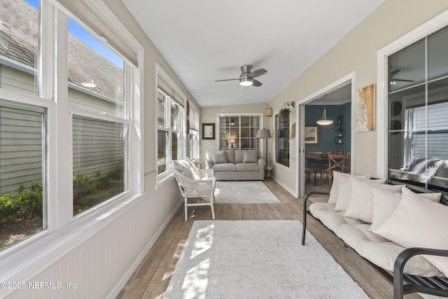 sunroom / solarium featuring wood finished floors