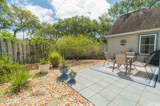 view of patio / terrace with outdoor dining area and a fenced backyard