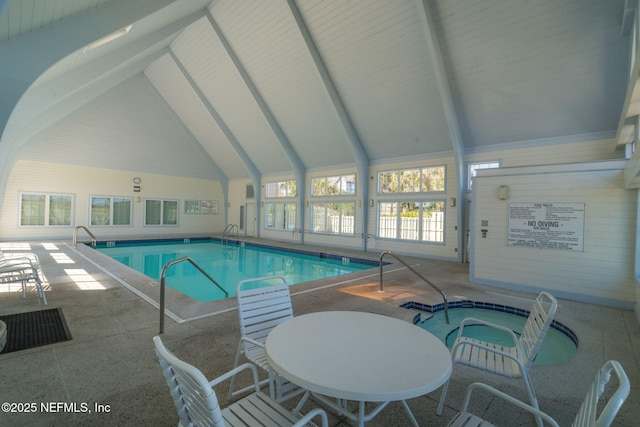 community pool featuring an indoor hot tub