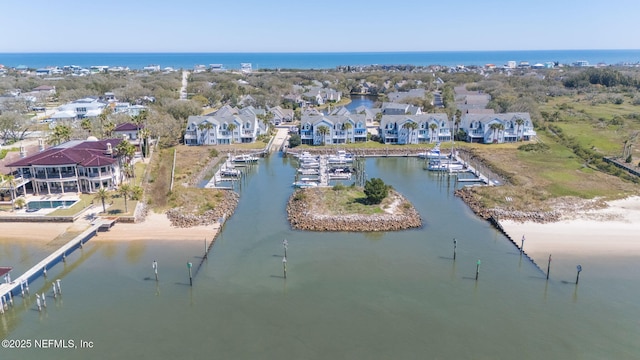 birds eye view of property with a residential view and a water view