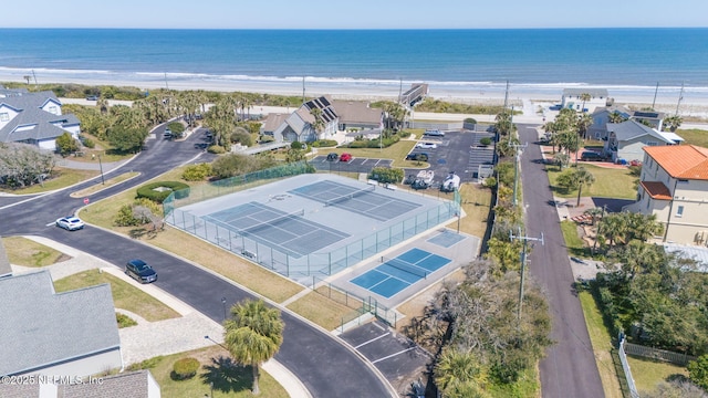 birds eye view of property featuring a water view and a view of the beach