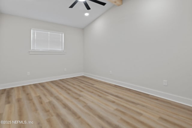 10856 Hawaii Dr S, Jacksonville, FL 32246 - empty room featuring a ceiling fan, baseboards, vaulted ceiling with beams, and wood finished floors