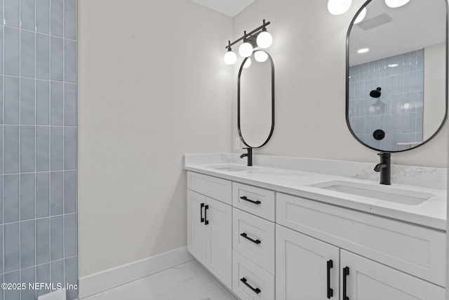 10856 Hawaii Dr S, Jacksonville, FL 32246 - full bath featuring double vanity, baseboards, a sink, and marble finish floor