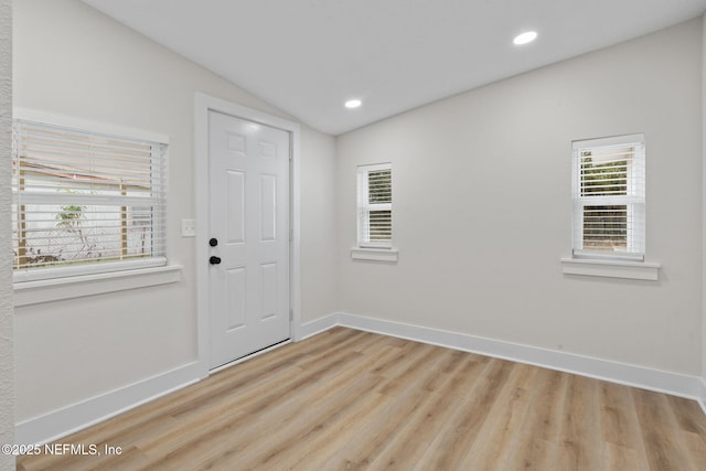 10856 Hawaii Dr S, Jacksonville, FL 32246 - entryway with recessed lighting, baseboards, vaulted ceiling, and light wood-type flooring