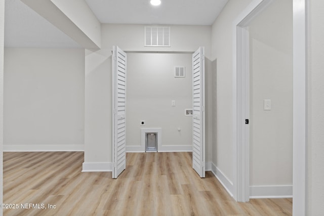 10856 Hawaii Dr S, Jacksonville, FL 32246 - hallway featuring baseboards, visible vents, and wood finished floors